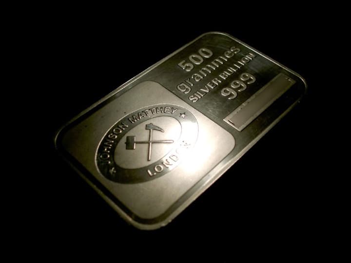 A 500 gram Johnson Matthey London silver bullion bar stamped 999, with the crossed-hammers logo